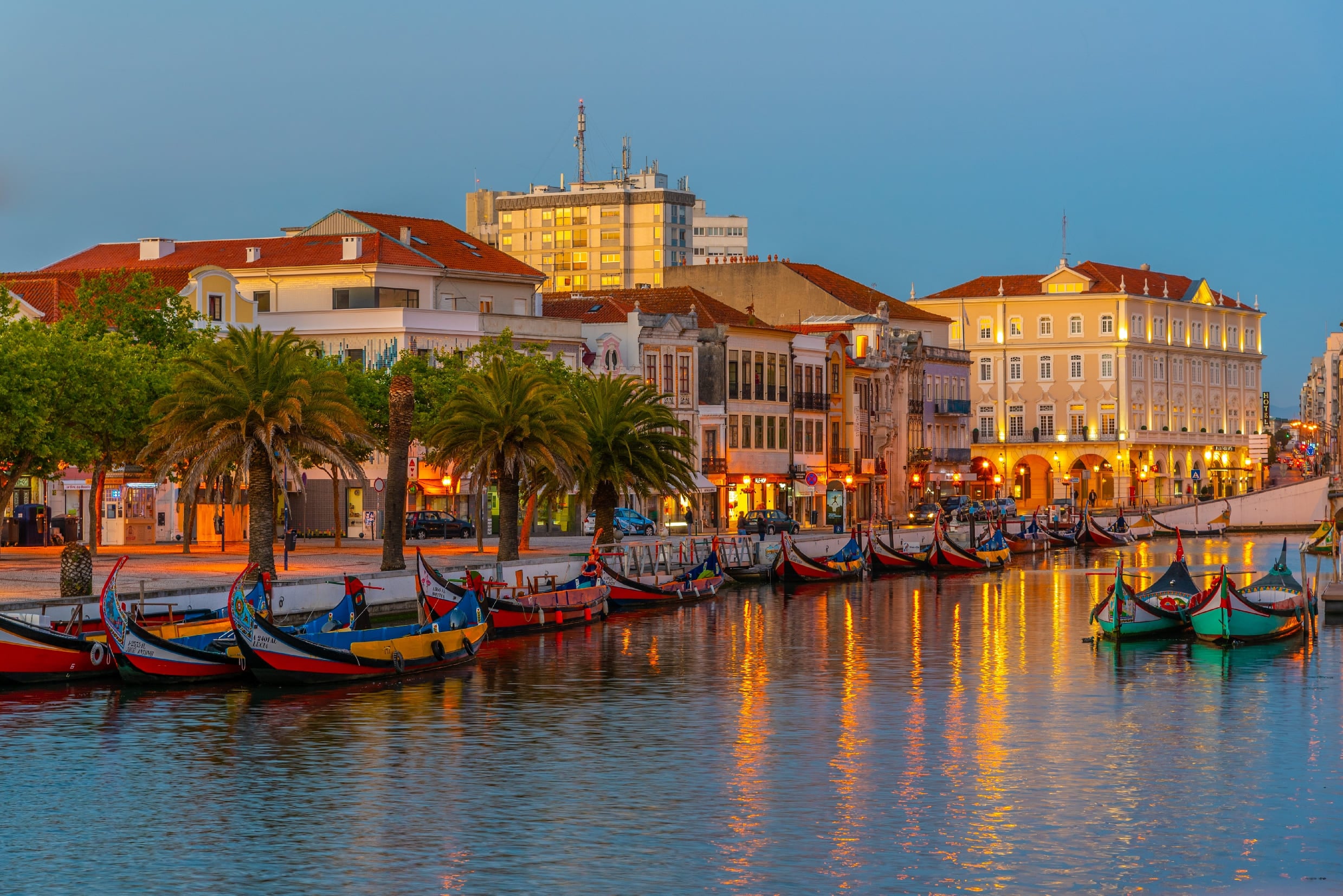Waterfront of Aveiro at dusk and traditional boats along the river, Portugal