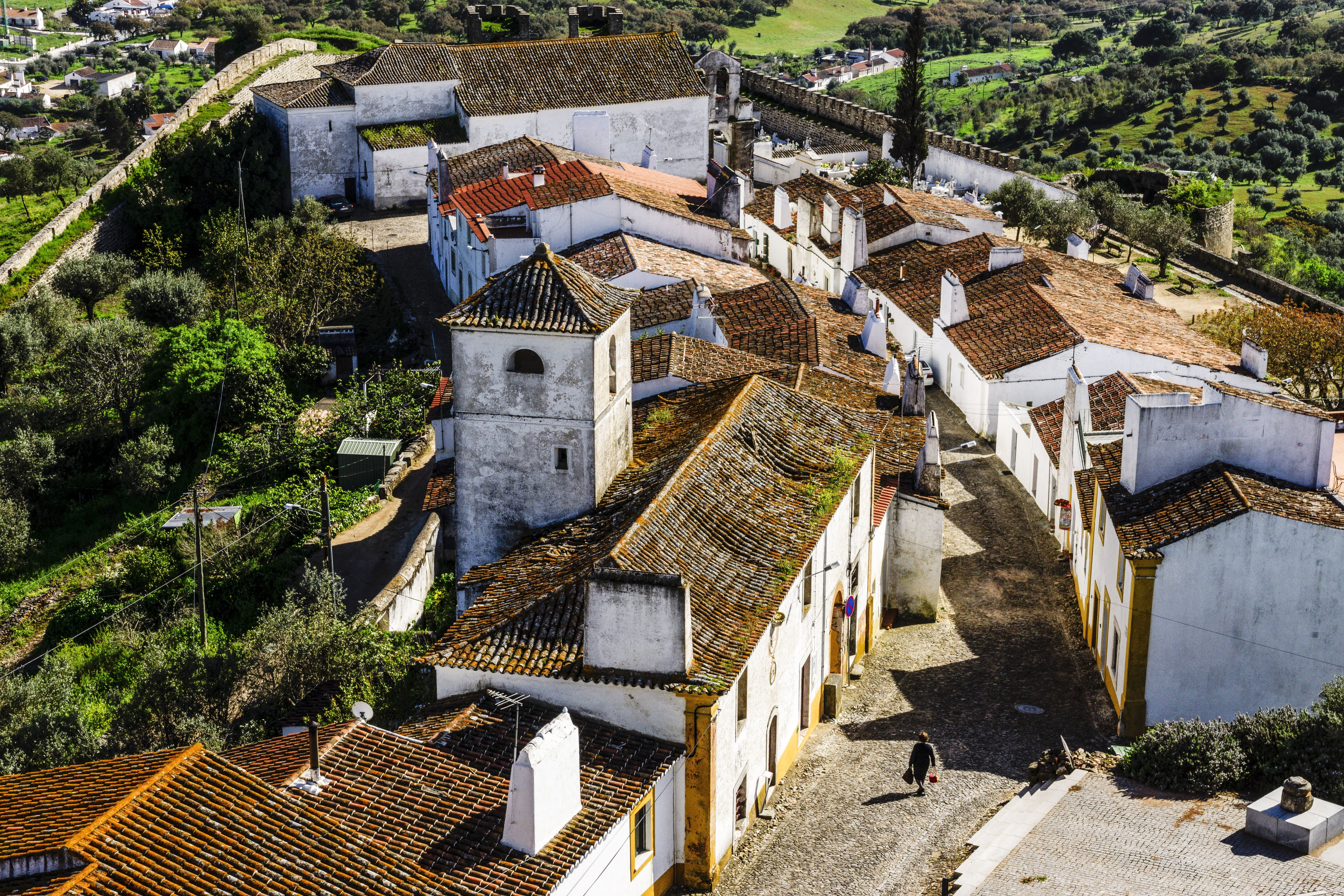 Aerial shot of whitewashed houses of Evoramonte in spring in Portugal