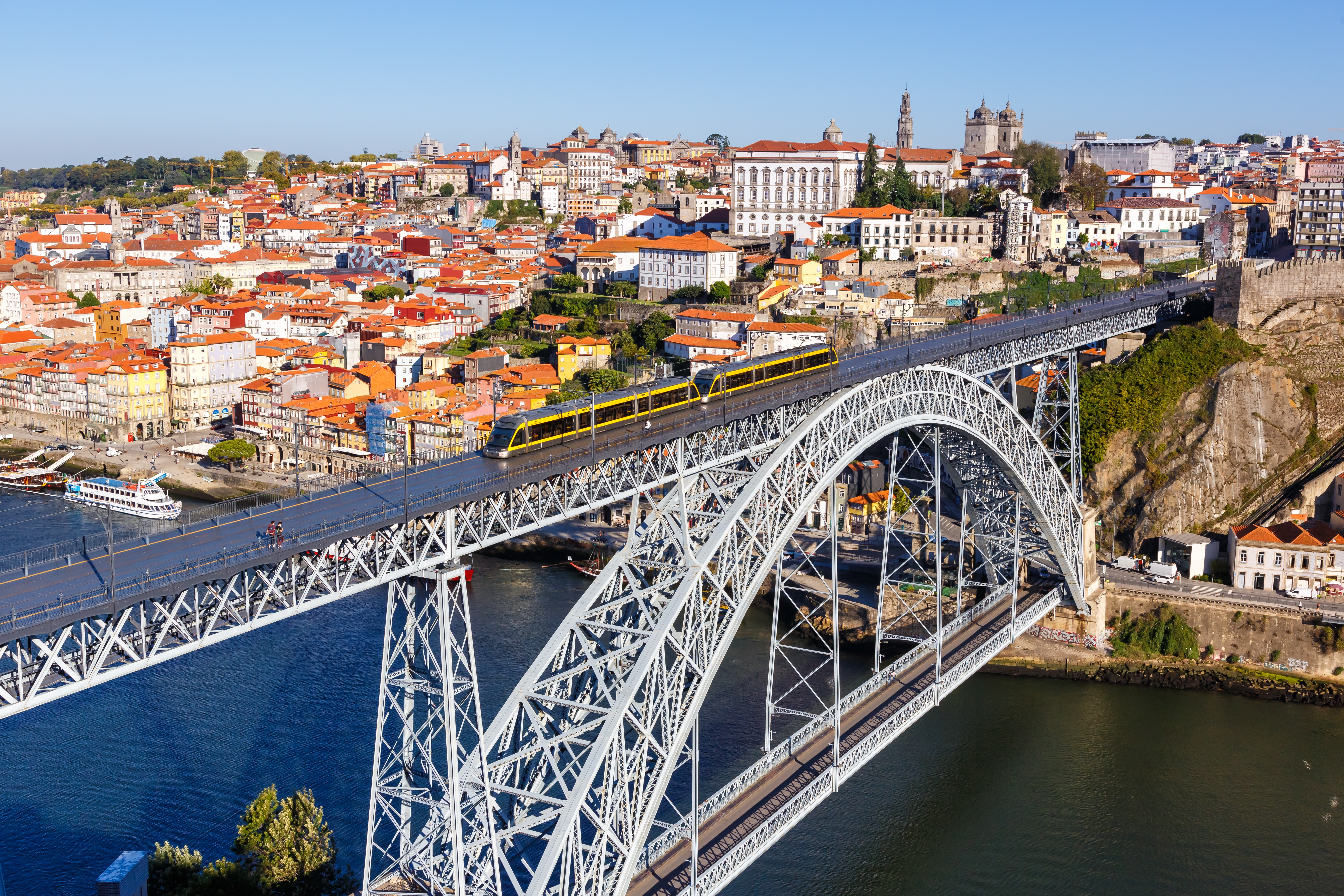 A train going over the Dom Luís I Bridge in Porto