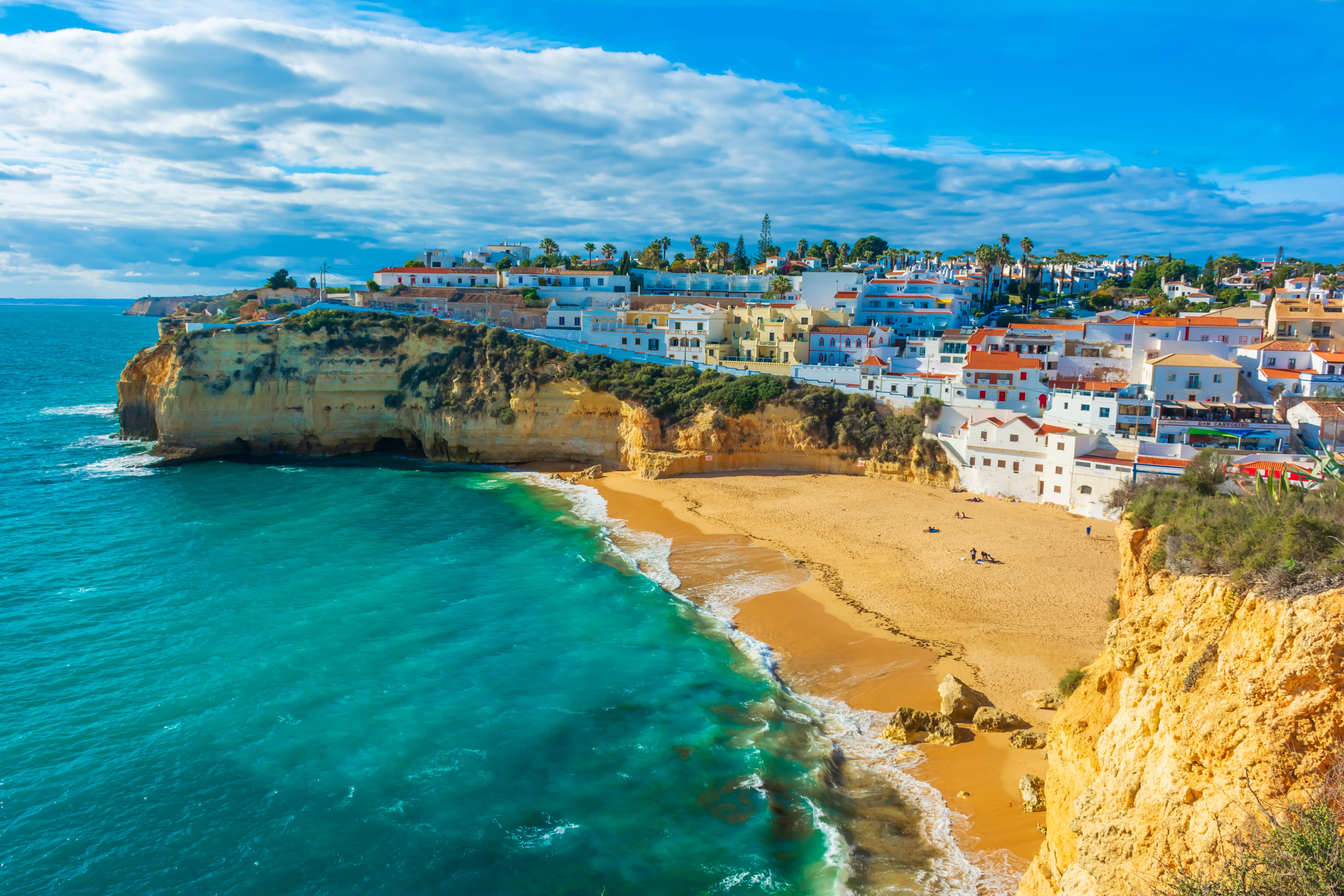 aerial shot of golden beach in Faro District, Algarve, Portugal