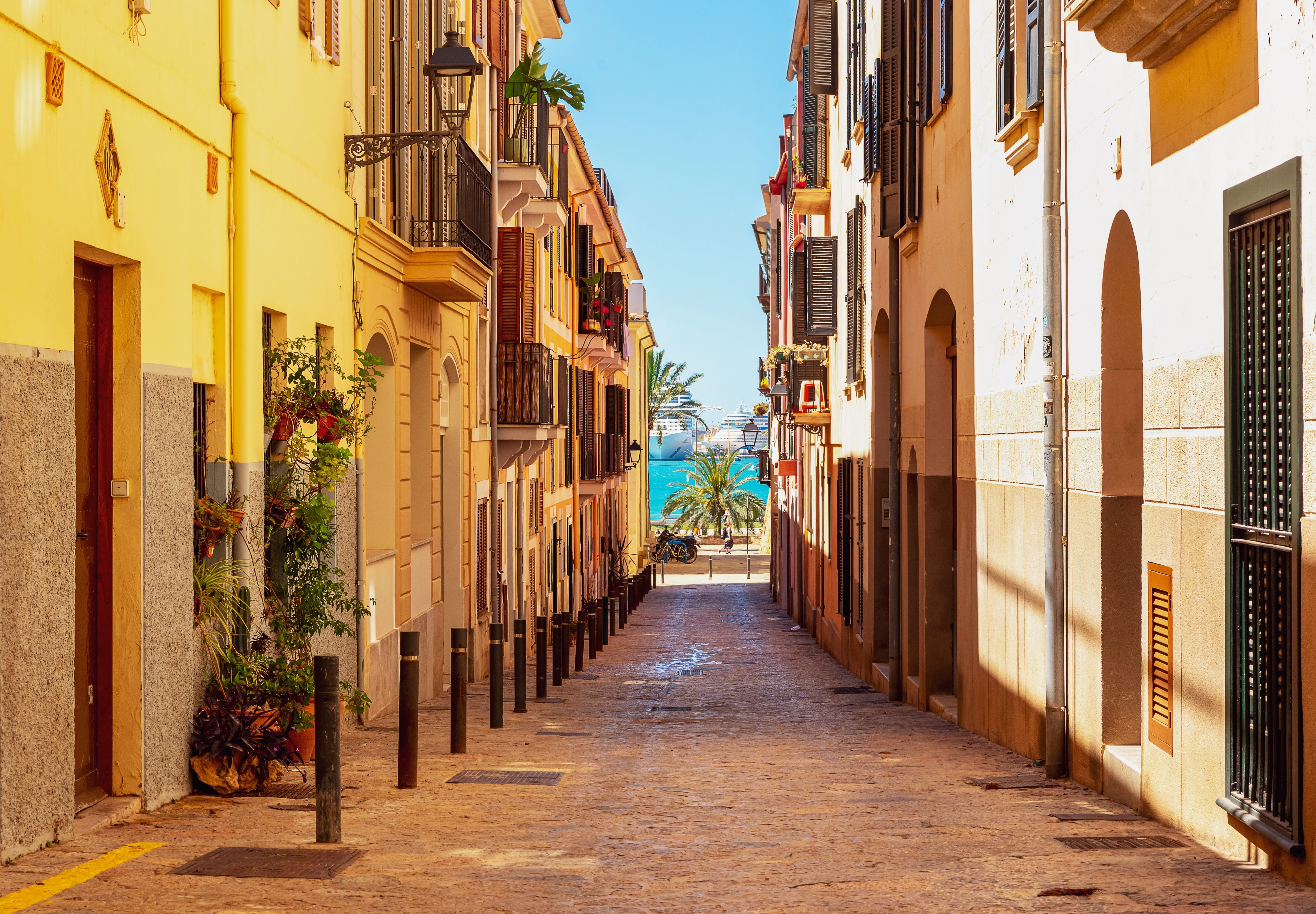 Colourful street in the Old Town of Palma, leading to the Mediterranean Sea on the island of Mallorca