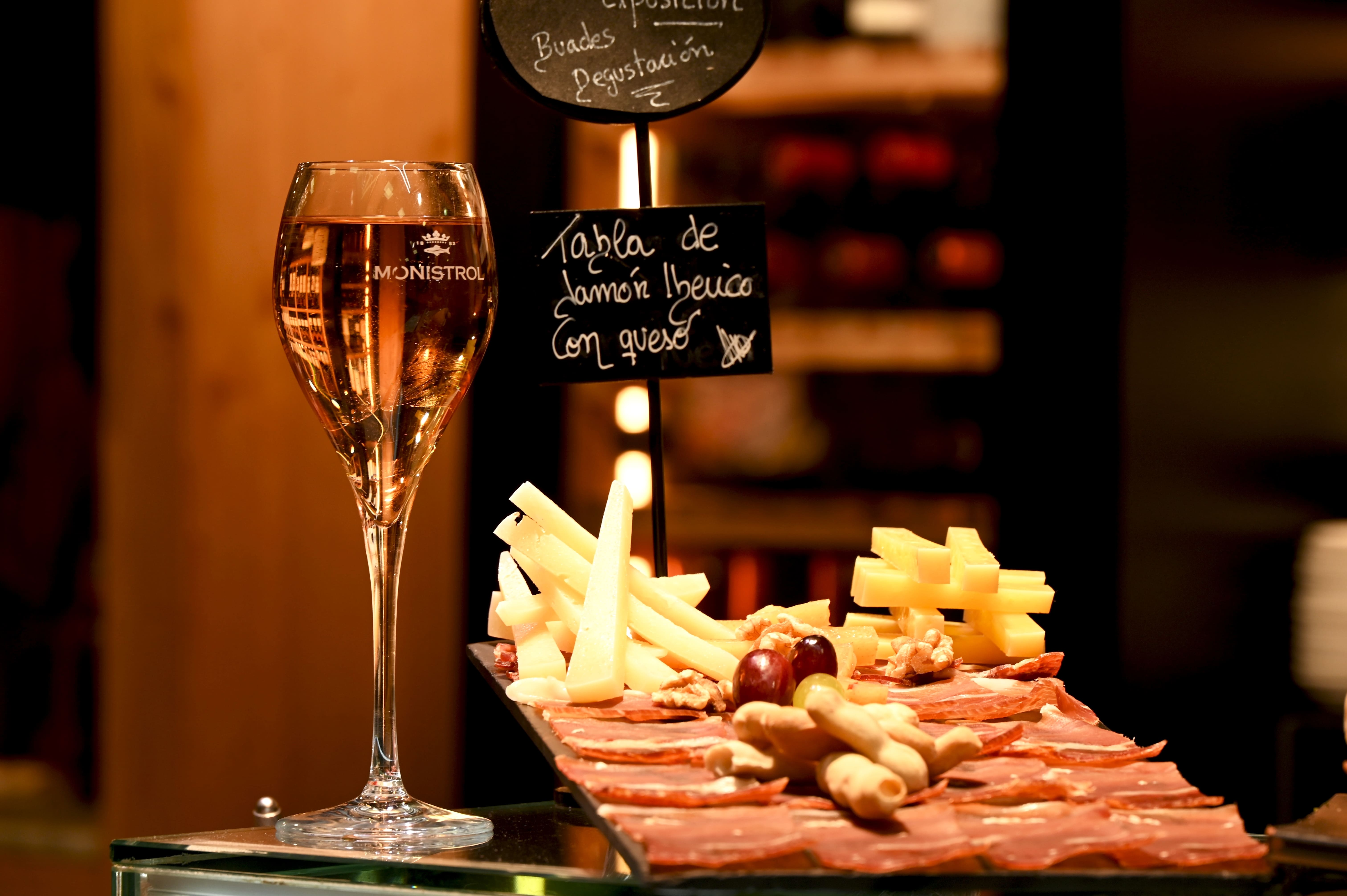 Cold meats, cheese and wine in a low-lit restaurant in Palma de Mallorca