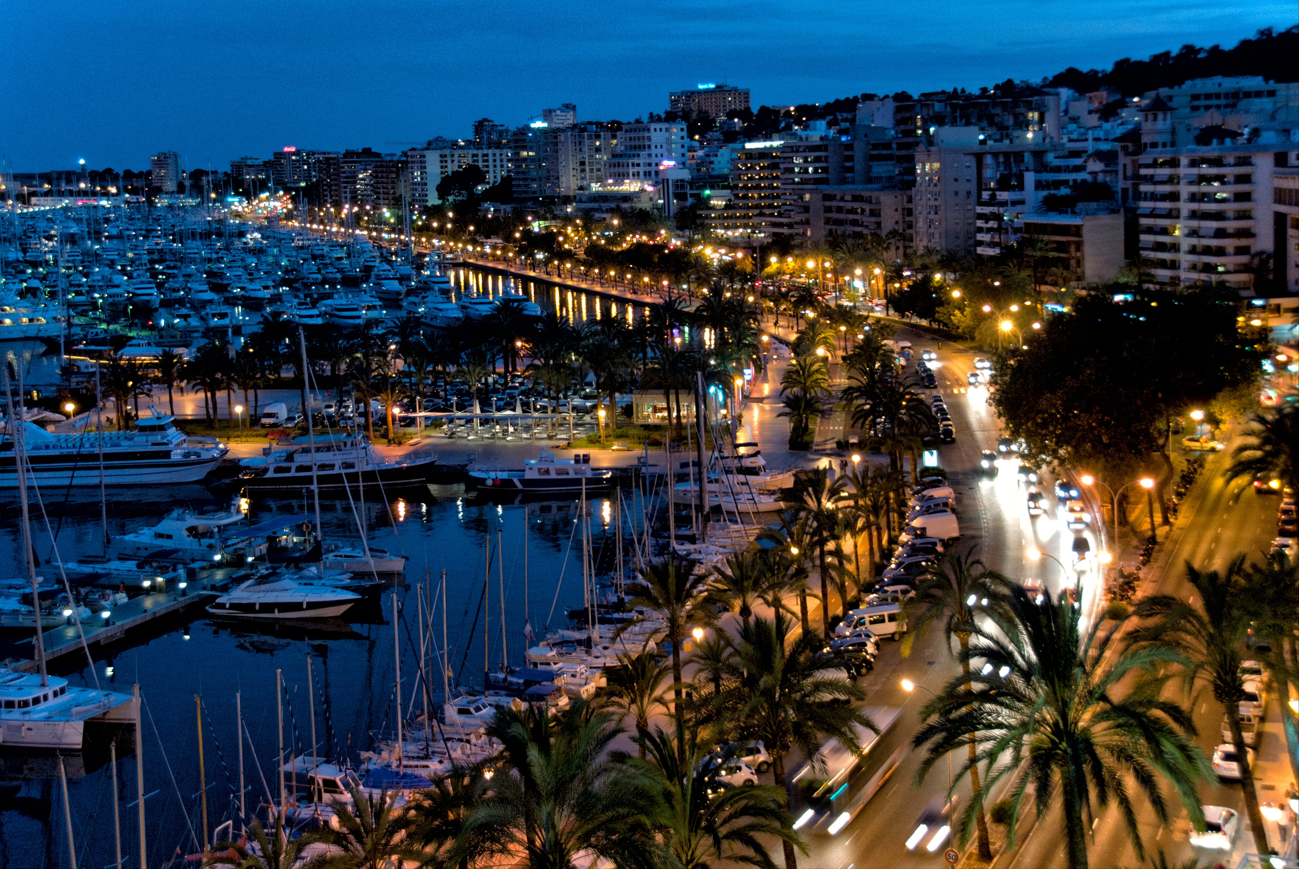  Avenida de Gabriel Roca along Mediterranean Sea shore at night, near marina and port