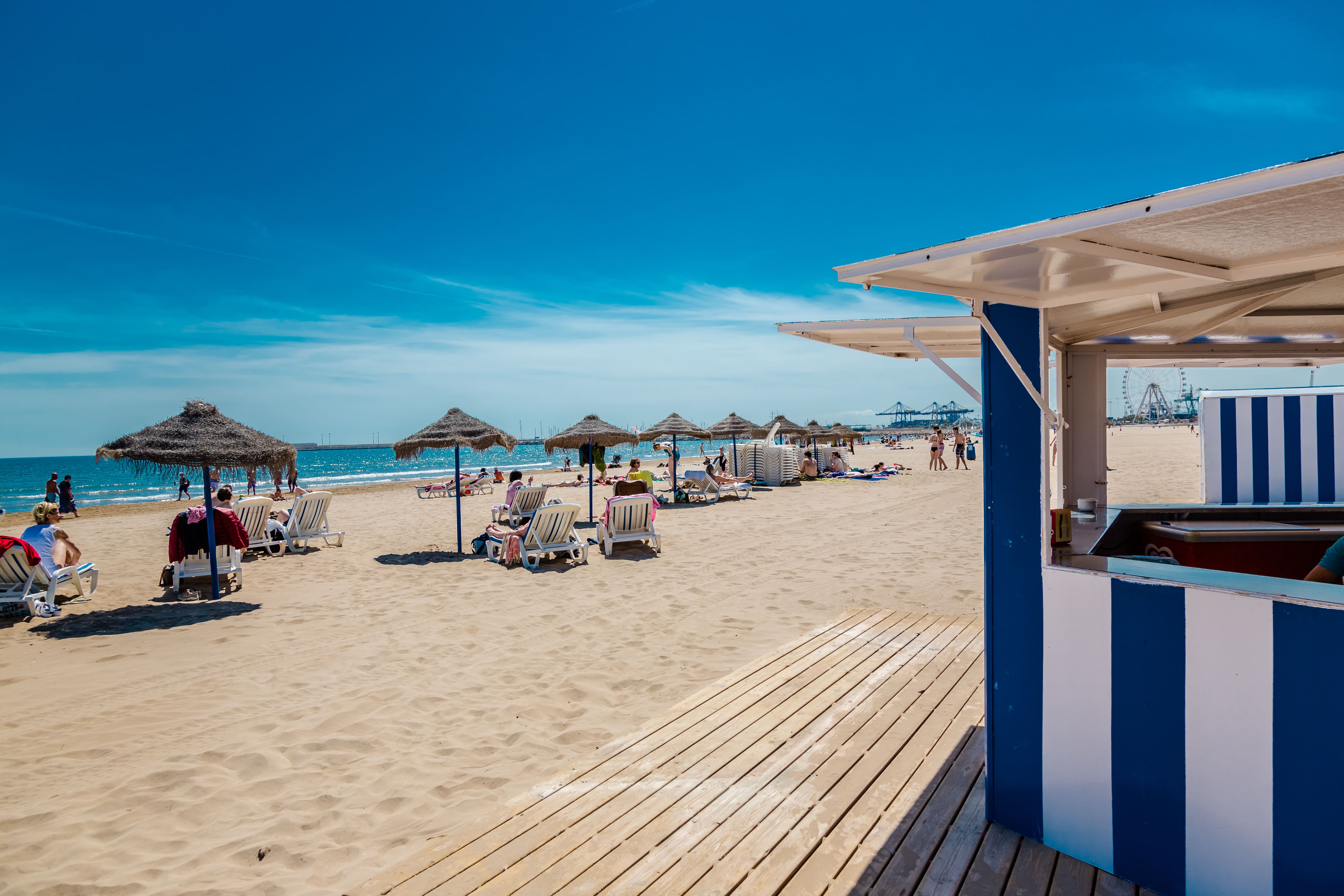 Sunbeds on beach in Valencia, Spain