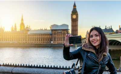 London girl taking selfie Thames